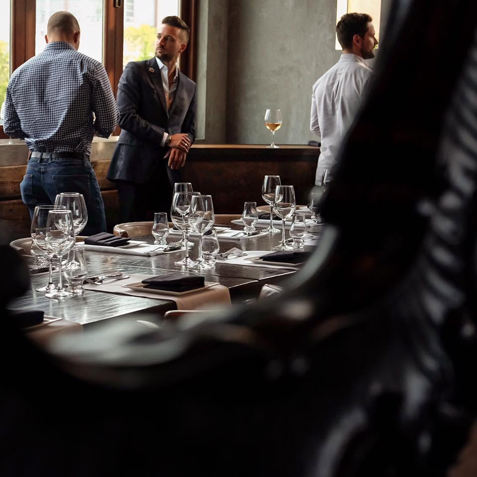 Hospitality professionals preparing a table